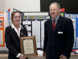 Sophie Burling with the 'Excellence Award' she received from Northland Regional Council member Joe Carr.